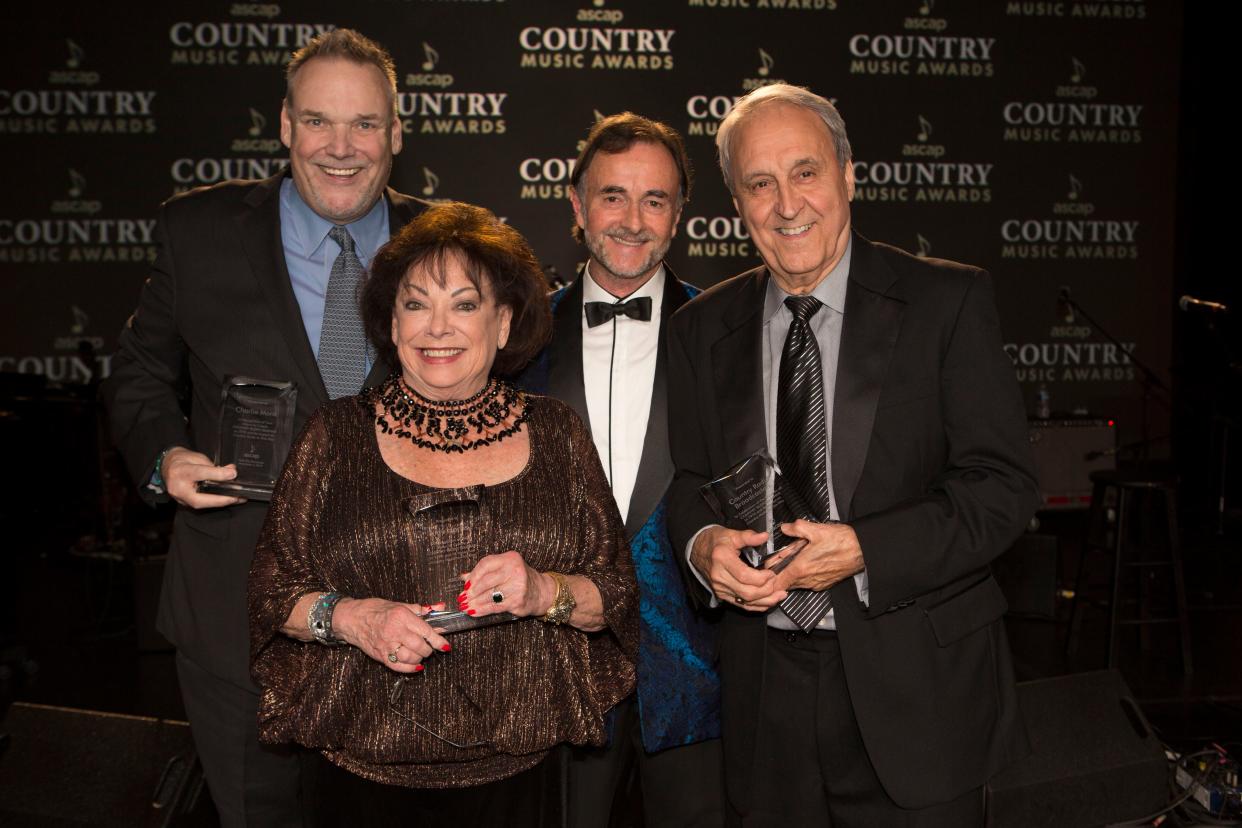 CRS Executive Director Bill Mayne and former ASCAP executives Judy Harris, owner Judy Harris Music, and Charlie Monk, CRS Director Emeritus, accepted the honor from ASCAP Board Member Barry Coburn, 2015