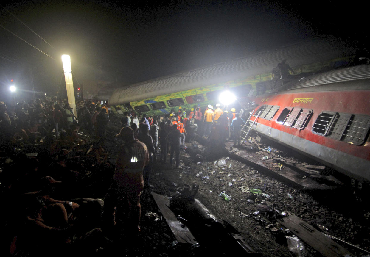 Rescuers work at the site of passenger trains accident, in Balasore district, in the eastern Indian state of Orissa, Saturday, June 3, 2023.Two passenger trains derailed in India, killing more than 200 people and trapping hundreds of others inside more than a dozen damaged rail cars officials said. (AP Photo)