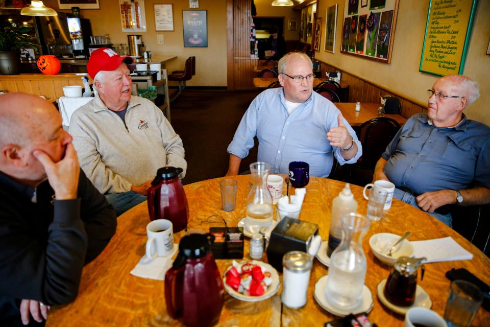 Joe Coleman, Sonni Sonnichsen, Eric Skoog and Wayne Igou sit at the Round Table in Cronk's Café in 2018, discussing politics.