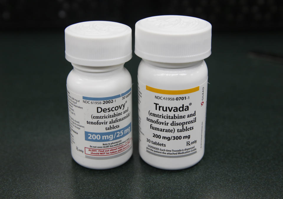 The HIV prevention drugs Descovy, left and Truvada, right, are displayed at Pucci's Pharmacy in Sacramento, Calif., Monday, Oct. 7, 2019. Gov. Gavin Newsom signed a bill, SB159, by state Sen. Scott Wiener, D-San Francisco, Monday, authorizing pharmacists to sell the HIV preventative medications to patients without a physician's prescription. (AP Photo/Rich Pedroncelli)