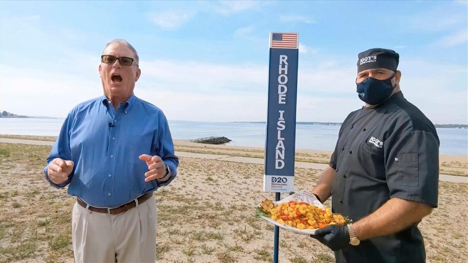 In this image from video, Rhode Island Democratic Party Chairman and state Rep. Joseph McNamara speaks during the state roll-call vote on the second night of the Democratic National Convention in August 2020. At right is John Bordieri, executive chef at Iggy’s Boardwalk in Warwick, with a big order of calamari.