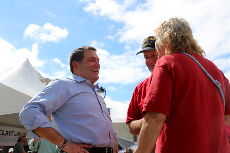 Sen. Mark Green leans back into a laugh as he talks with residents in Henderson, Tenn., on Sept. 28, 2018.