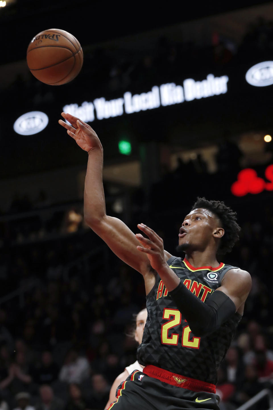 Atlanta Hawks guard Cam Reddish (22) passes the ball during the first half of the team's NBA basketball game against the Miami Heat on Thursday, Oct. 31, 2019, in Atlanta. (AP Photo/John Bazemore)
