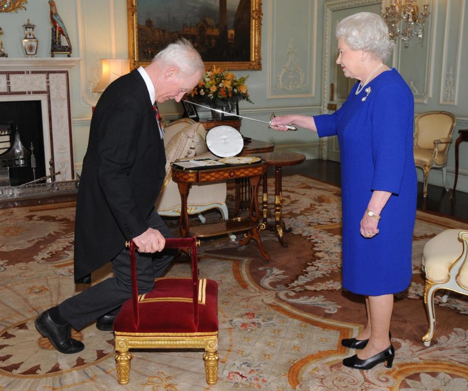 <p>Her Majesty knights Sir Garth Morrison inside the Private Audience Room, honoring him for his service as a Chief Scout. </p>