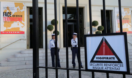 Two policewomen stand guard before the opening of the Euro-Mediterranean conference of cities on the prevention of radicalisation and for the fight against terrorism in Nice, France September 29, 2017. The slogan reads :"Facing the challenges of terrorism." REUTERS/Eric Gaillard/Files