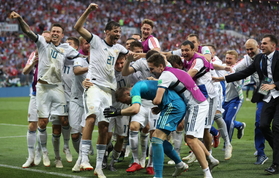 <p>The Russia team celebrate as they book their place in the final eight </p>