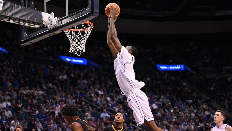 Brigham Young Cougars forward Atiki Ally Atiki (4) flies in for a dunk as BYU and SE Louisiana play at the Marriott Center in Provo on Wednesday, Nov. 15, 2023. BYU won 105-48.