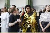 A model is being made up before the prsentation of Chanel Haute Couture Spring/Summer 2020 fashion collection, Tuesday Jan.21, 2020 in Paris. (AP Photo/Thibault Camus)