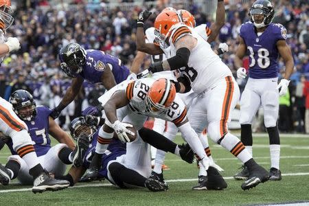 Dec 28, 2014; Baltimore, MD, USA; Cleveland Browns running back Terrance West (28) dives into the end zone for a touchdown during the third quarter against the Baltimore Ravens at M&T Bank Stadium. Mandatory Credit: Tommy Gilligan-USA TODAY Sports