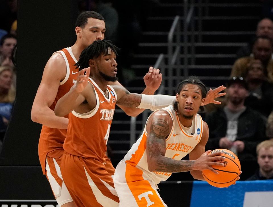 Texas guard Tyrese Hunter applies defensive pressure on Tennessee guard Zakai Zeigler during Saturday night's NCAA Tournament loss in Charlotte, N.C. Hunter said he intends to get an NBA draft evaluation before he decides whether or not to return for next season, just like he did last year.