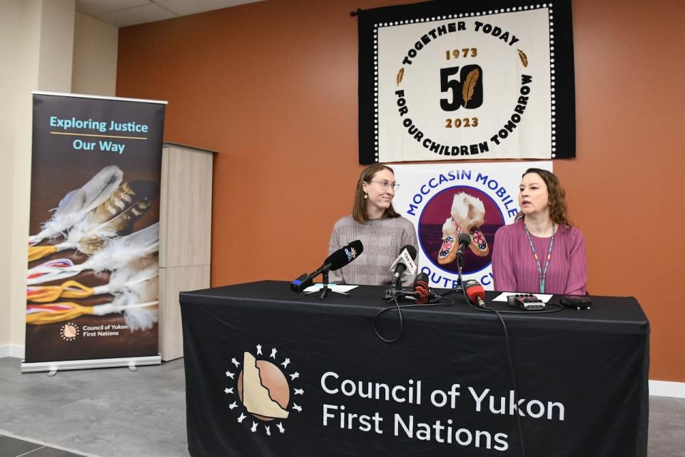 Council of Yukon First Nations executive director Shadelle Chambers, right, and justice manager Krista Mooney at a press conference in Whitehorse on Jan. 29, 2024 announcing the launch of the Moccasin Mobile Outreach program. The program will see staff drive around downtown Whitehorse in a van offering support to vulnerable people in need.  