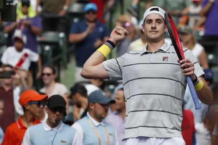 Mar 28, 2018; Key Biscayne, FL, USA; John Isner of the United States celebrates after his match against Hyeon Chung of Korea (not pictured) on day nine at the Miami Open at Tennis Center at Crandon Park. Isner won 6-1. 6-4. Mandatory Credit: Geoff Burke-USA TODAY Sports
