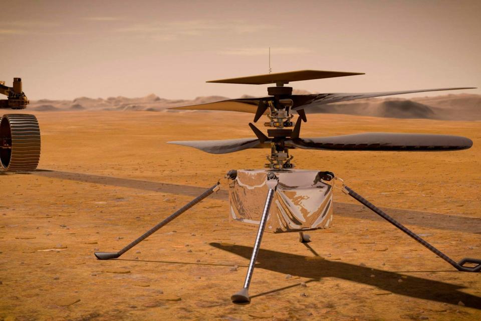 Nasa illustration shows the Ingenuity Mars Helicopter near the Perseverance rover (AP)