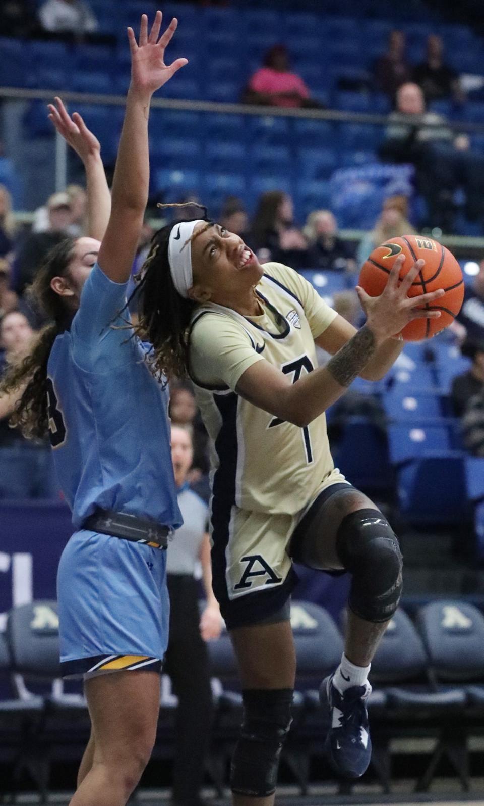 Kent Stat's Corynne Hauser defends as Akron's Dominique Camp looks to shoot Wednesday, Feb. 1, 2023, at Rhodes Arena.