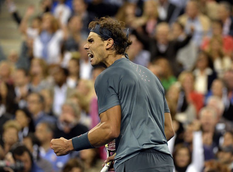 Rafael Nadal of Spain reacts during his game against Novak Djokovic of Serbia at the 2013 US Open men's singles final match at the USTA Billie Jean King National Tennis Center in New York on September 9, 2013. Nadal won 6-2, 3-6, 6-4, 6-1