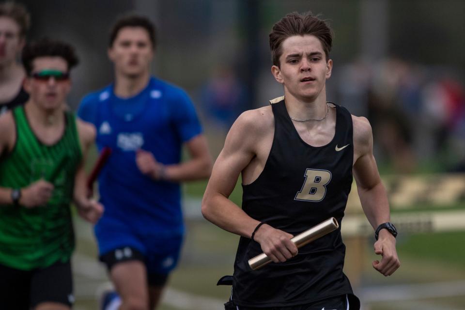 Boonville’s Eli Mayes leads in the 4x800 meter relay during a track meet in Boonville, Ind., Tuesday, April 9, 2024.