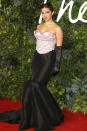 <p>continues her red carpet hot streak in a Richard Quinn gown featuring a pink crystal-embellished bustier and black taffeta fishtail skirt, worn with black opera gloves for added fashion drama. </p>