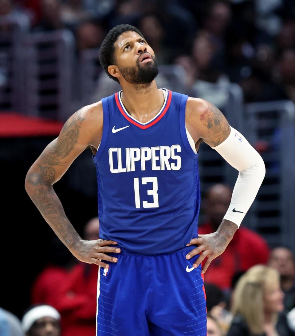 Clippers star Paul George looks up at a video board during a game against Minnesota in March.