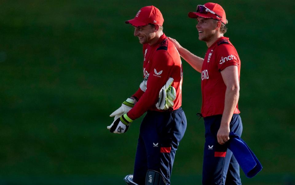 Jos Buttler and Sam Curran celebrate England's victory.