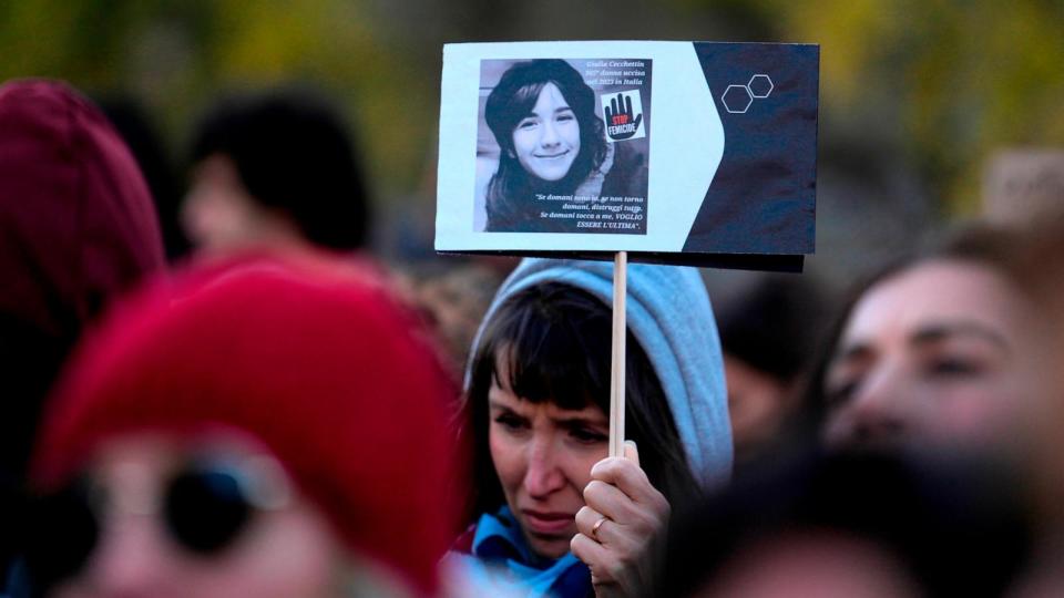 PHOTO: A woman shows a photo of Giulia Cecchettin, allegedly murdered by her ex-boyfriend, on the occasion of International Day for the Elimination of Violence against Women, in Milan, Nov. 25, 2023.  (Luca Bruno/AP)