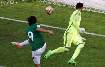 Football Soccer - Bolivia v Argentina - World Cup 2018 Qualifiers - Hernando Siles stadium, La Paz, Bolivia 28/3/17. Bolivia's Marcelo Martins scores a goal past Argentina's goalkeeper Sergio Romero. REUTERS/Manuel Claure