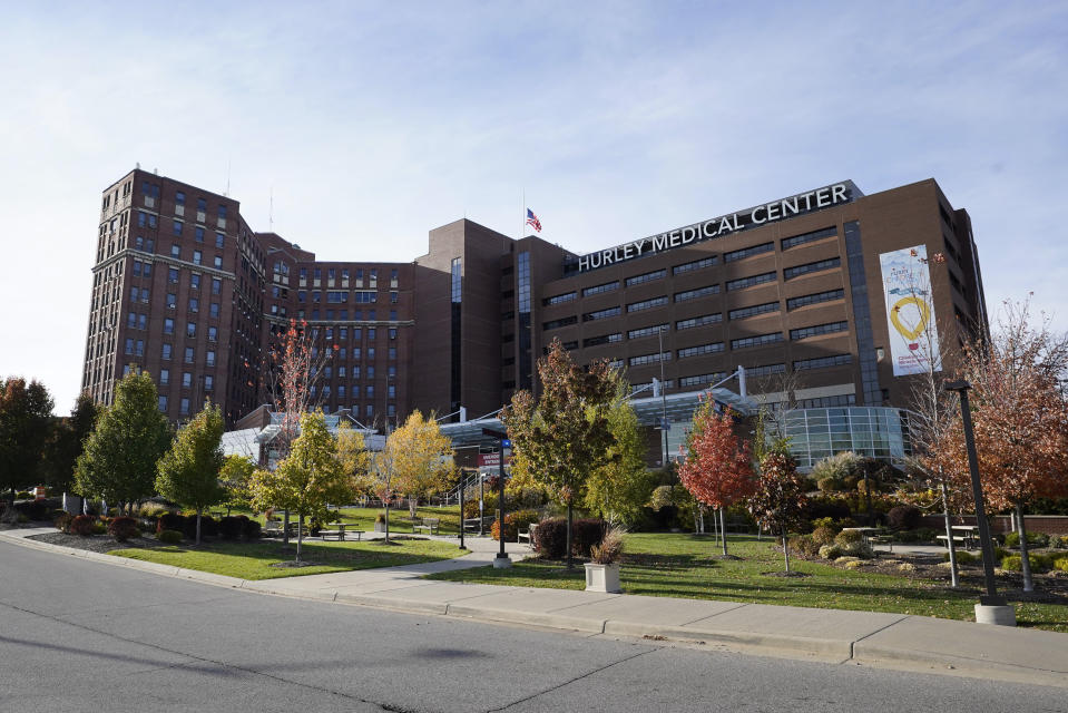 This photo shows Hurley Medical Center in Flint, Mich., Wednesday, Oct. 28, 2020. U.S. hospitals are scrambling to hire more nurses as the coronavirus pandemic surges, leading to stiff competition and increased costs. Adding to the strain, experienced nurses are "burned out with this whole (pandemic)” and some are quitting, said Kevin Fitzpatrick, an emergency room nurse at the center, where several left just in the past month to work in hospice or home care or at outpatient clinics. (AP Photo/Paul Sancya)
