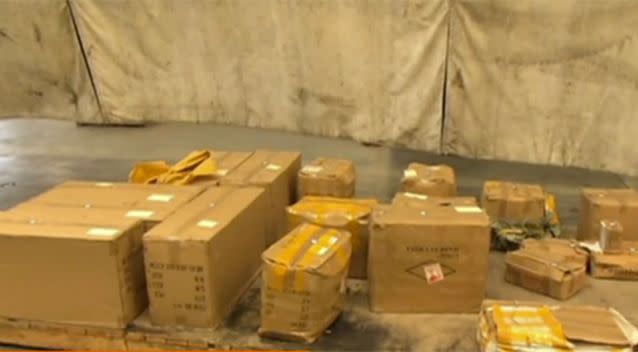 Boxes of weapons have been seized by officers. Photo: 7 News