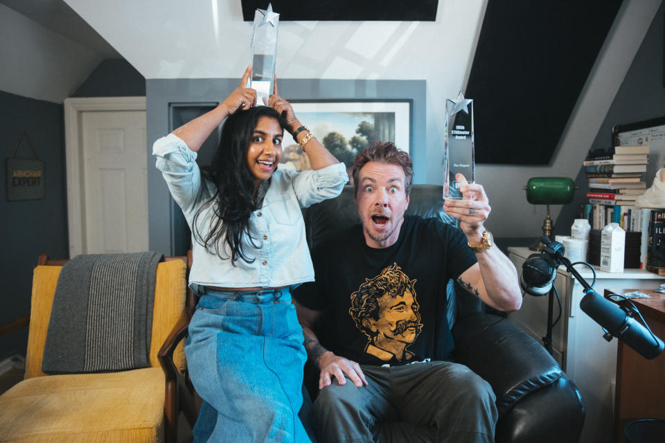 <p><em>Armchair Expert</em> co-hosts Monica Padman and Dax Shepard accept their STARmeter Award for Podcasts from IMDb in their studio on Sept. 29. </p>