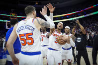 New York Knicks' Josh Hart (3) and teammate Isaiah Hartenstein (55) celebrate after winning Game 6 in an NBA basketball first-round playoff series against the Philadelphia 76ers, Thursday, May 2, 2024, in Philadelphia. (AP Photo/Matt Slocum)