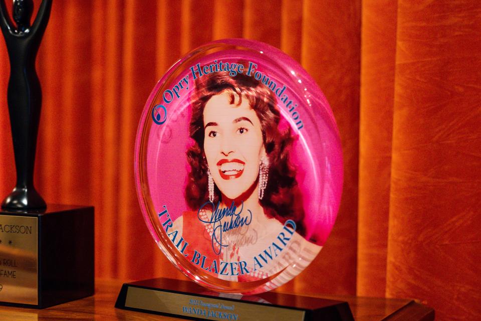 An award given to Wanda Jackson is displayed in her Oklahoma City home on Thursday, Sept. 7, 2023. The award depicts Jackson, now 85, as a young performer. The Rock and Roll Hall of Famer launched her legendary singing career when she was still in high school, and it has spanned 70 years in rock, country and gospel music.