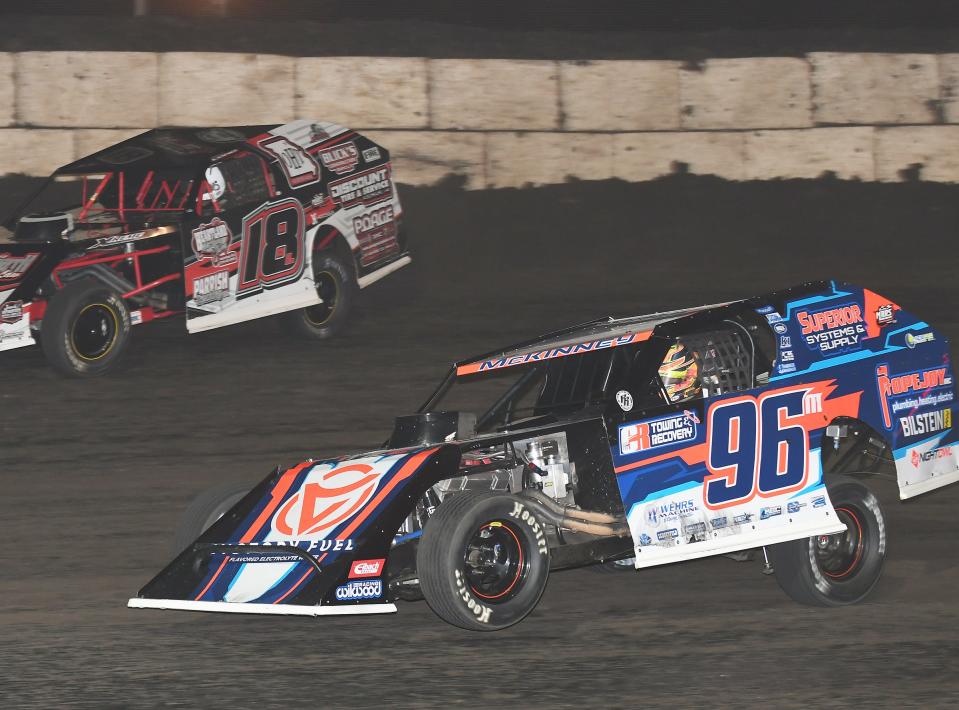 Mike McKinney (96) overtakes Michael Long (18) for the lead in the 30-lap, MARS modified race. McKinney went on to claim the checkered flag.