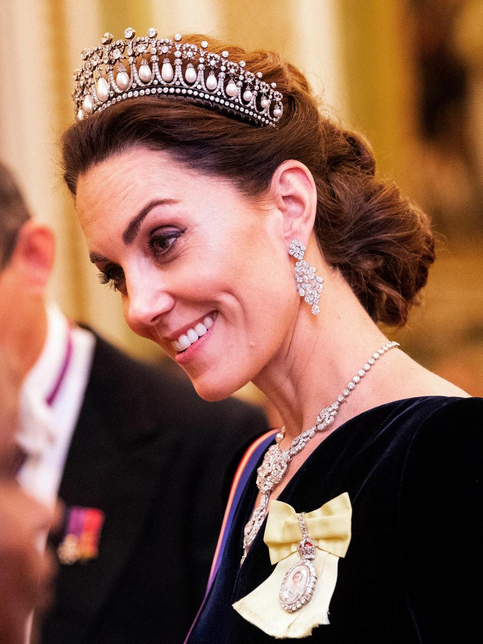 Catherine, Duchess of Cambridge talks to guests at an evening reception for members of the Diplomatic Corps at Buckingham Palace on December 11, 2019 in London, England.