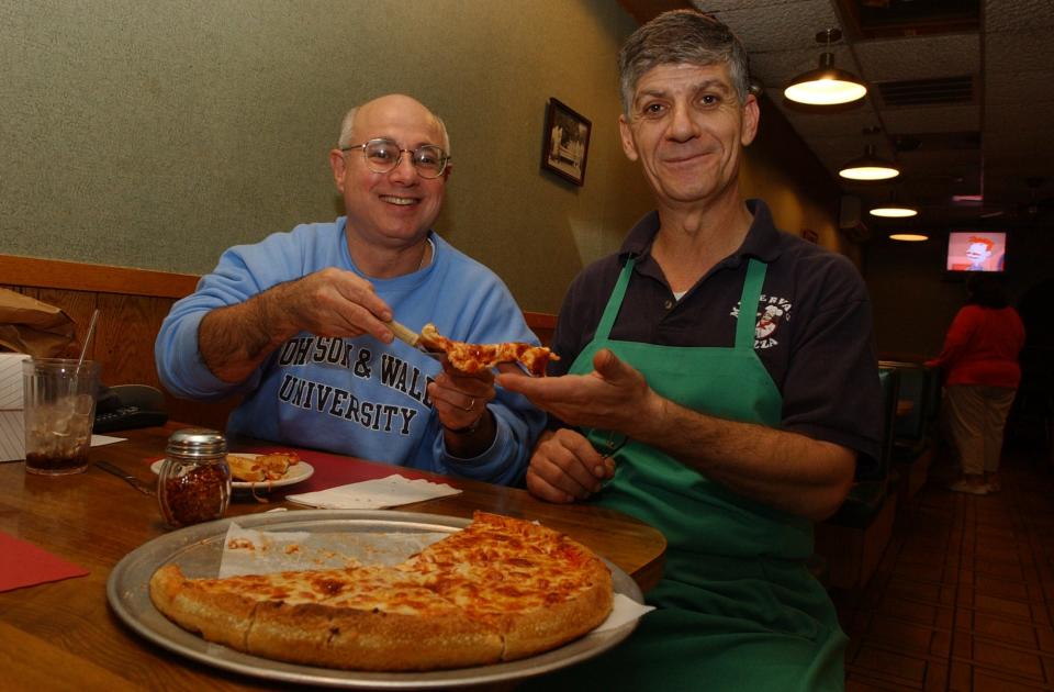 Minerva's Pizza owner Kabalan Habchi with Peter Reinhart, author of "American Pie" in 2003, a year after Habchi and his wife Kaylin bought the restaurant.