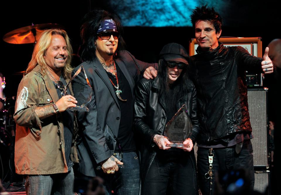 Mötley Crüe members Vince Neil, left, Nikki Six, Mick Mars and Tommy Lee on stage in West Hollywood, Calif., in 2011.