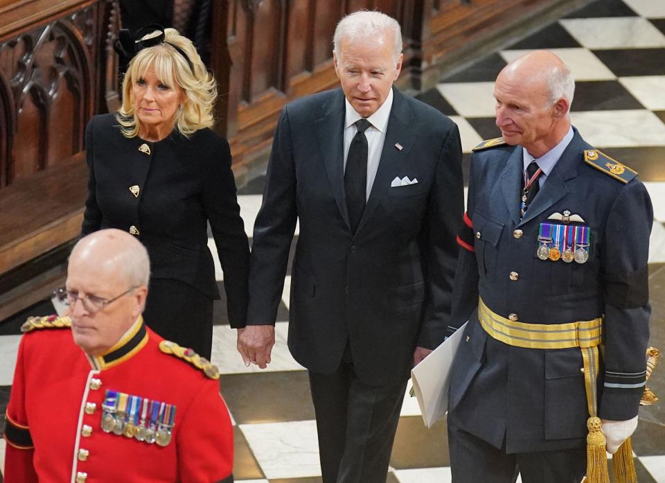 US President Joe Biden and first lady Jill Biden arrive to take their seats inside Westminster Abbey in London on September 19, 2022, for the State Funeral Service for Britain's Queen Elizabeth II.