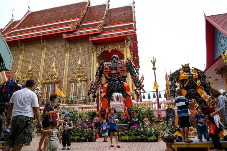 Instead of the traditional tranquil Buddhas and mythical beasts that adorn most monasteries in the land, the shimmering Wat Ta Kien temple outside Bangkok is guarded by three towering Transformer robots