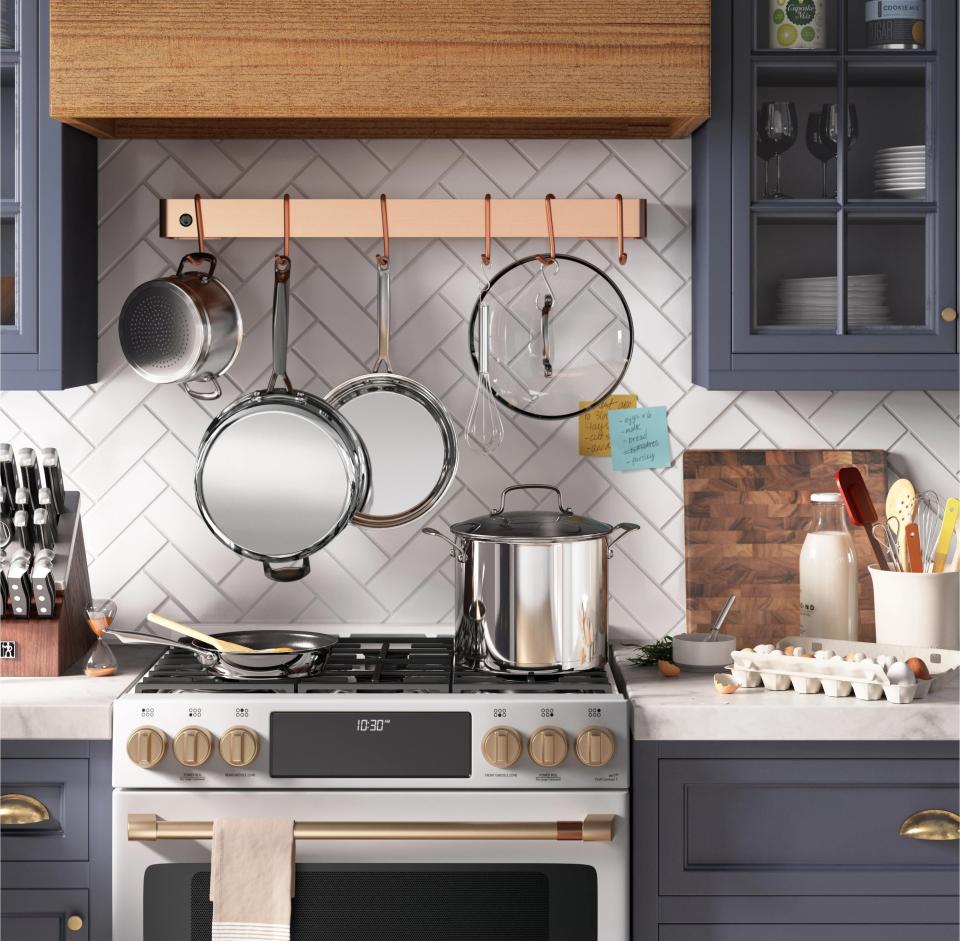 The pots and pans displayed in a kitchen