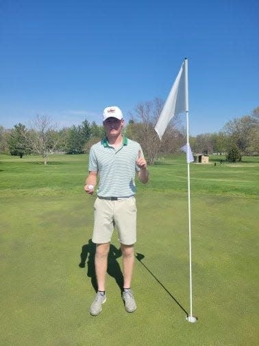 Woodward-Granger's Dane Polich poses for a photo after making a hole-in-one on May 4 at Jester Park.