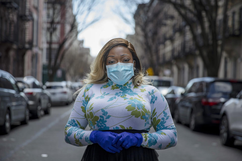 Tiffany Pinckney poses for a portrait in the Harlem neighborhood of New York on April 1, 2020. After a period of quarantine at home separated from her children, she has recovered from COVID-19. Pinckney became one of the nations first donors of "convalescent plasma." Using the blood product is experimental but scientists hope it could help treat the seriously ill and plan to test if it might offer some protection against infection for those at high risk. (AP Photo/Marshall Ritzell)