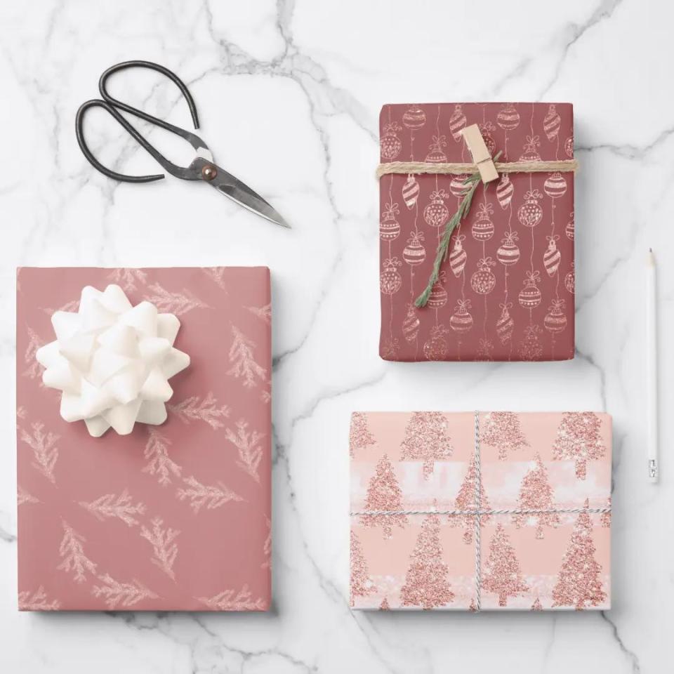 <p><a href="https://go.redirectingat.com?id=74968X1596630&url=https%3A%2F%2Fwww.zazzle.com%2Felegant_rose_gold_glitter_pink_christmas_trio_gift_wrapping_paper_sheets-256360223372198837&sref=https%3A%2F%2Fwww.thepioneerwoman.com%2Fholidays-celebrations%2Fgifts%2Fg41544243%2Fbest-christmas-wrapping-paper%2F" rel="nofollow noopener" target="_blank" data-ylk="slk:Shop Now;elm:context_link;itc:0;sec:content-canvas" class="link ">Shop Now</a></p><p>Elegant Rose Gold Christmas Trio Wrapping Paper</p><p>zazzle.com</p><p>$9.00</p><span class="copyright">Zazzle</span>