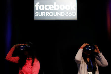 Attendees use Oculus virtual reality headset during the annual Facebook F8 developers conference in San Jose, California, U.S., April 18, 2017. REUTERS/Stephen Lam