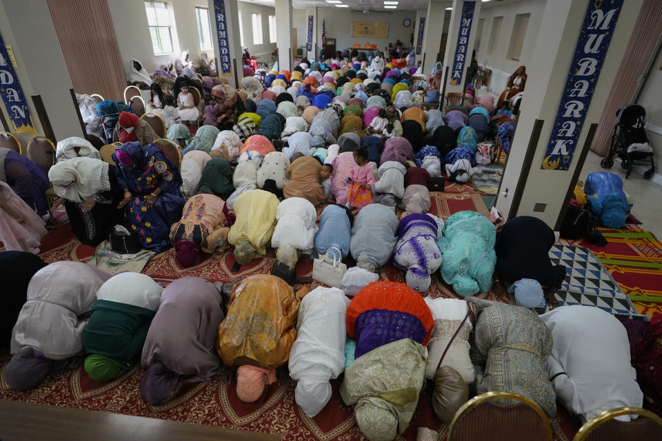 Women pray during Eid al-Fitr, Friday, April 21, 2023, at the Muslim Community Center in Silver Spring, Md. Eid al-Fitr marks the end of the Muslim holy fasting month of Ramadan. (AP Photo/Carolyn Kaster)