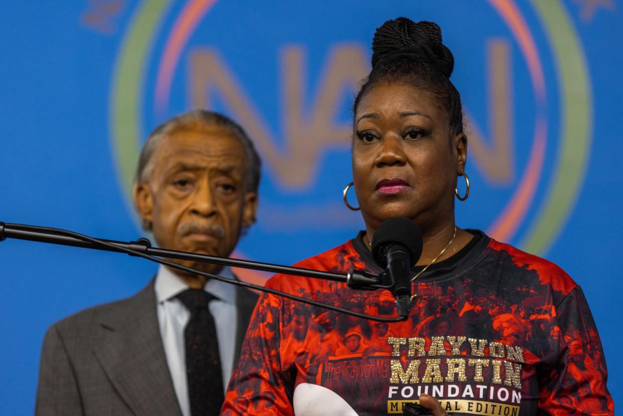 Sybrina Fulton, Trayvon Martin's mother speaks as the Rev. Al Sharpton looks on during a National Action Network commemoration of the 10th anniversary of Trayvon Martin's death on Saturday.