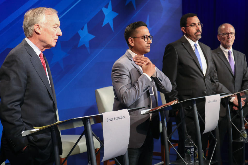 FILE - From left, Maryland Comptroller Peter Franchot, Ashwani Jain, John King and Tom Perez stand at their podiums just before a debate of eight candidates seeking the Democratic nomination for governor of Maryland June 6, 2022 in Owings Mills, Md. One of the best opportunities for Democrats to regain a governor’s office this year is in Maryland, and the race to succeed term-limited Republican Larry Hogan has drawn a crowd of candidates. (AP Photo/Brian Witte, File)