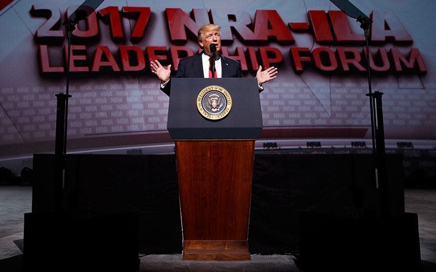 President Donald Trump speaks at the National Rifle Association Leadership Conference - AP Photo/Evan Vucci