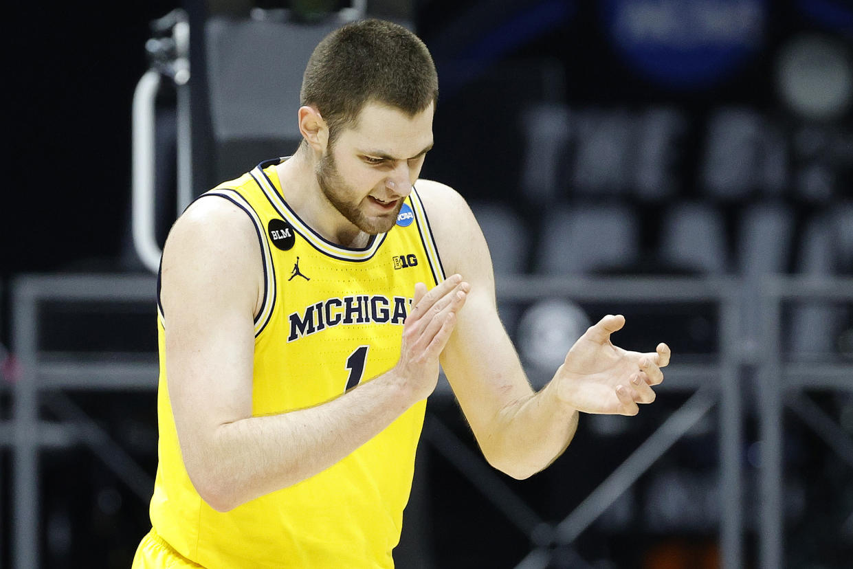INDIANAPOLIS, INDIANA - MARCH 30: Hunter Dickinson #1 of the Michigan Wolverines reacts during the first half against the UCLA Bruins in the Elite Eight round game of the 2021 NCAA Men's Basketball Tournament at Lucas Oil Stadium on March 30, 2021 in Indianapolis, Indiana. (Photo by Tim Nwachukwu/Getty Images)