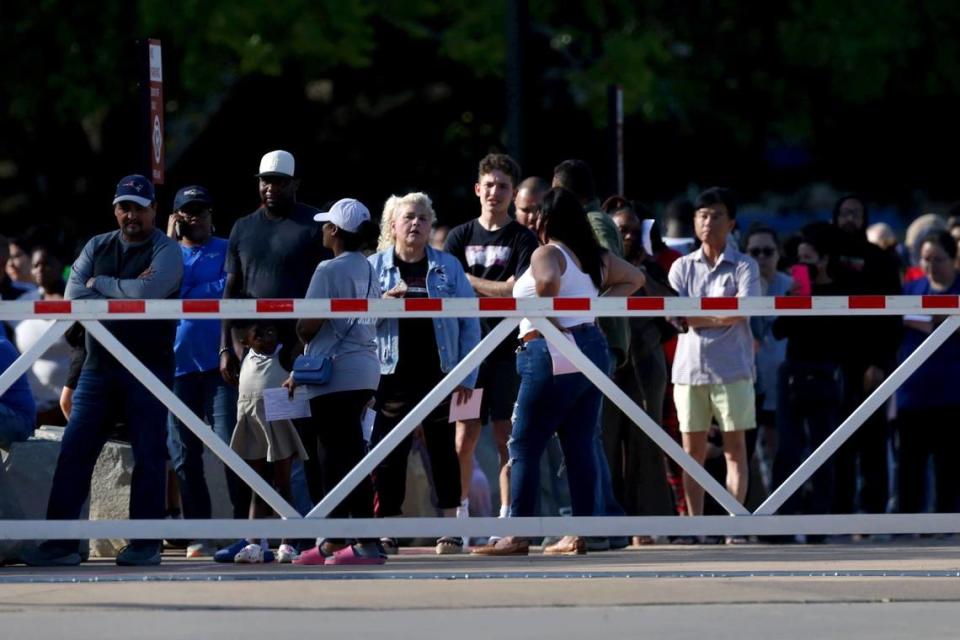 Parents and family line up outside Arlington ISD Athletic Center to be reunited with students following a shooting outside of Bowie High School in Arlington on Wednesday, April 24, 2024.