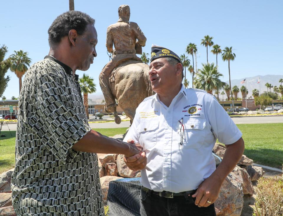 Alvin Taylor, left, talks with Amado Salinas II at Palm Springs City Hall on May 17.
