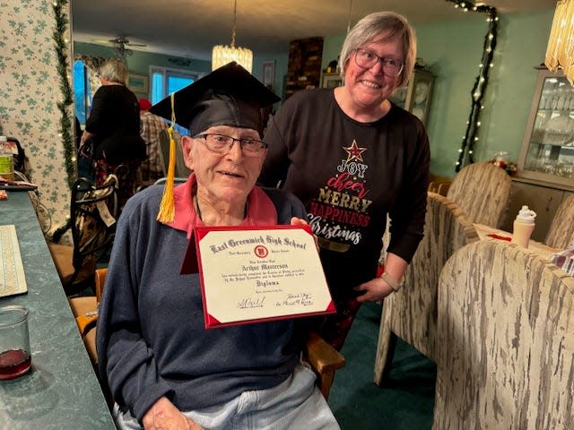 Arthur Masterson with his daughter, Elaine Vespia. His family reached out to East Greenwich Public Schools in December 2023 to help him get the high school diploma he never received due to leaving for WWII. He finally got his diploma on Christmas Day.