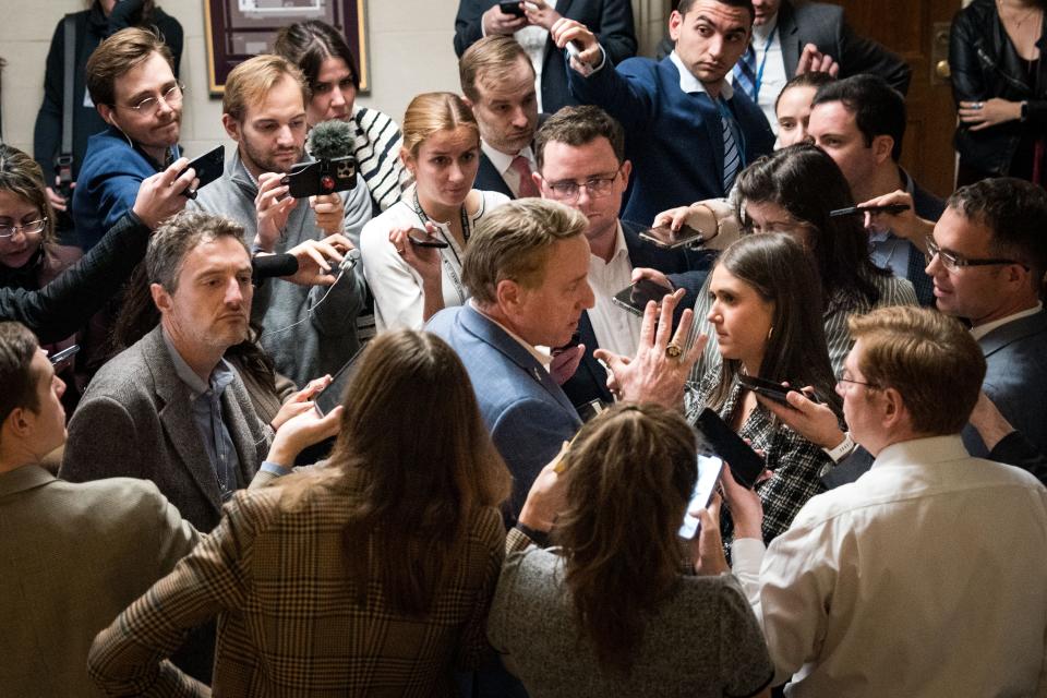 Rep. Pat Fallon (R-TX) is surrounded by a gaggle of reporters in the Longworth House Office Building as House lawmakers seek to elect a new speaker in Washington on Oct. 24, 2023.